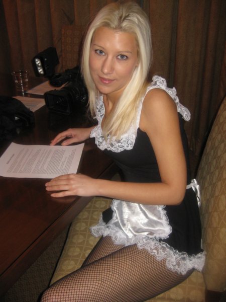 Jessica in her French Maid costume, studying her lines.
